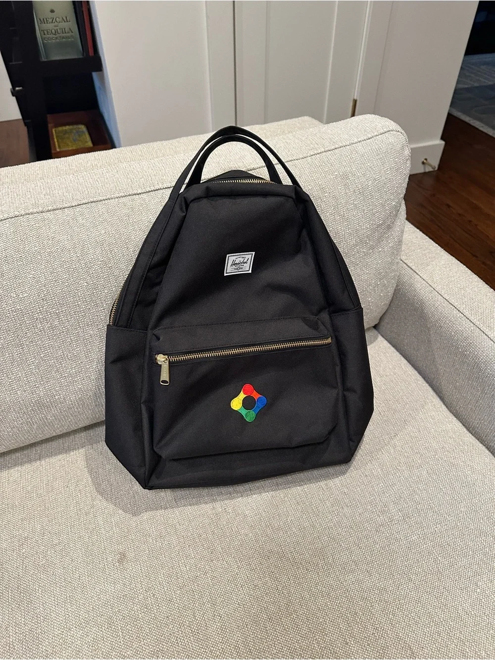 Black Herschel Backpack with Colorful Patch